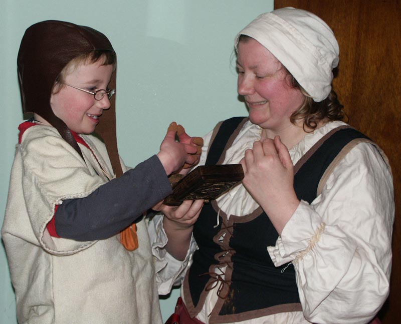 Jane the Baker introducing a child to 1666 chocolate